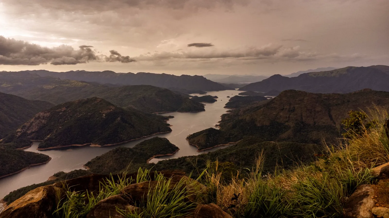 a hill country reservoir from above, the kind of waterdrome sri lanka domestic flights use