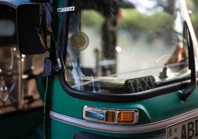 Sri Lanka tuk tuk: a green three-wheeler taxi close up on a Colombo street