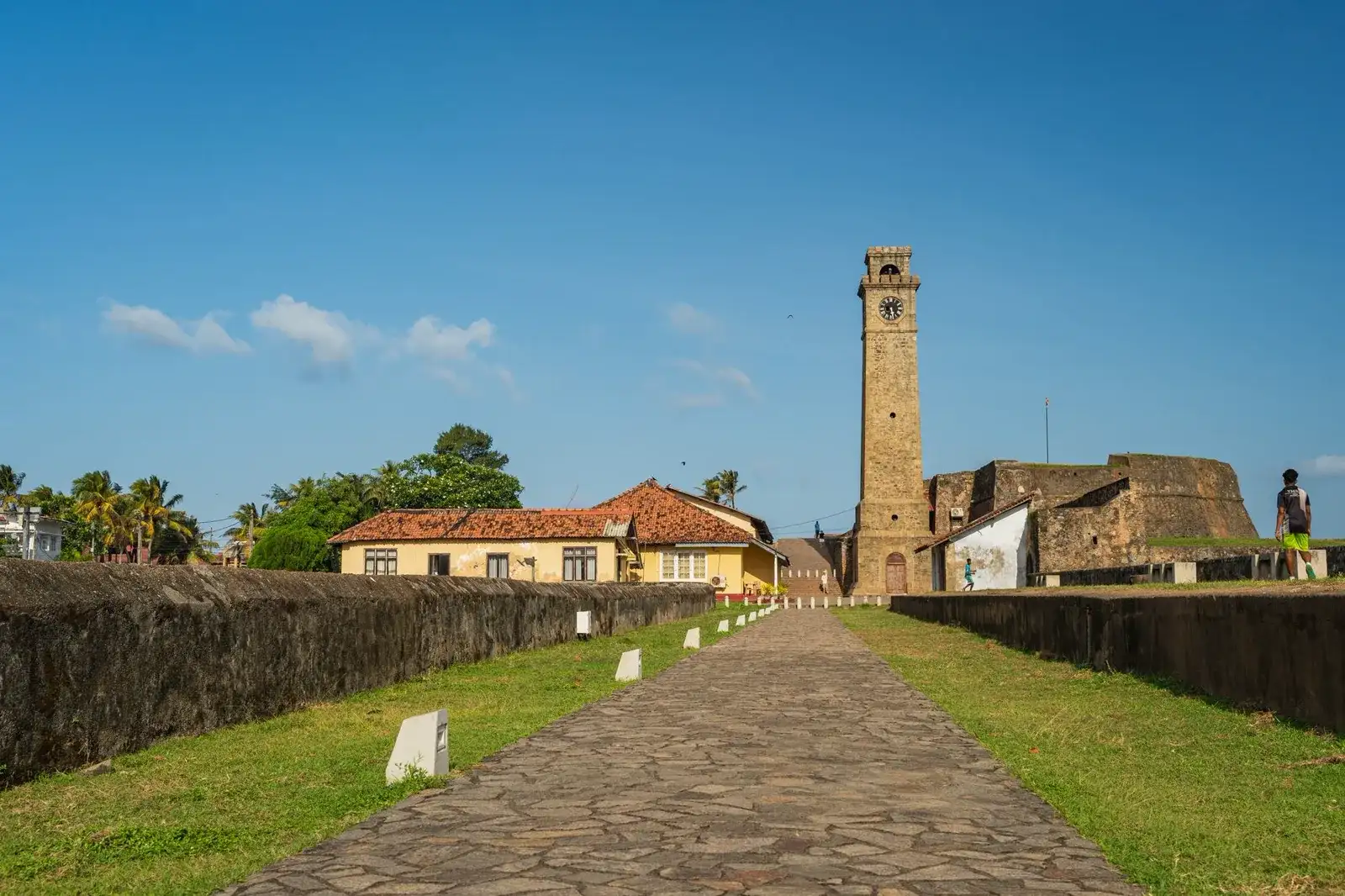 The Galle Fort lighthouse and its grass ramparts on the south coast of Sri Lanka