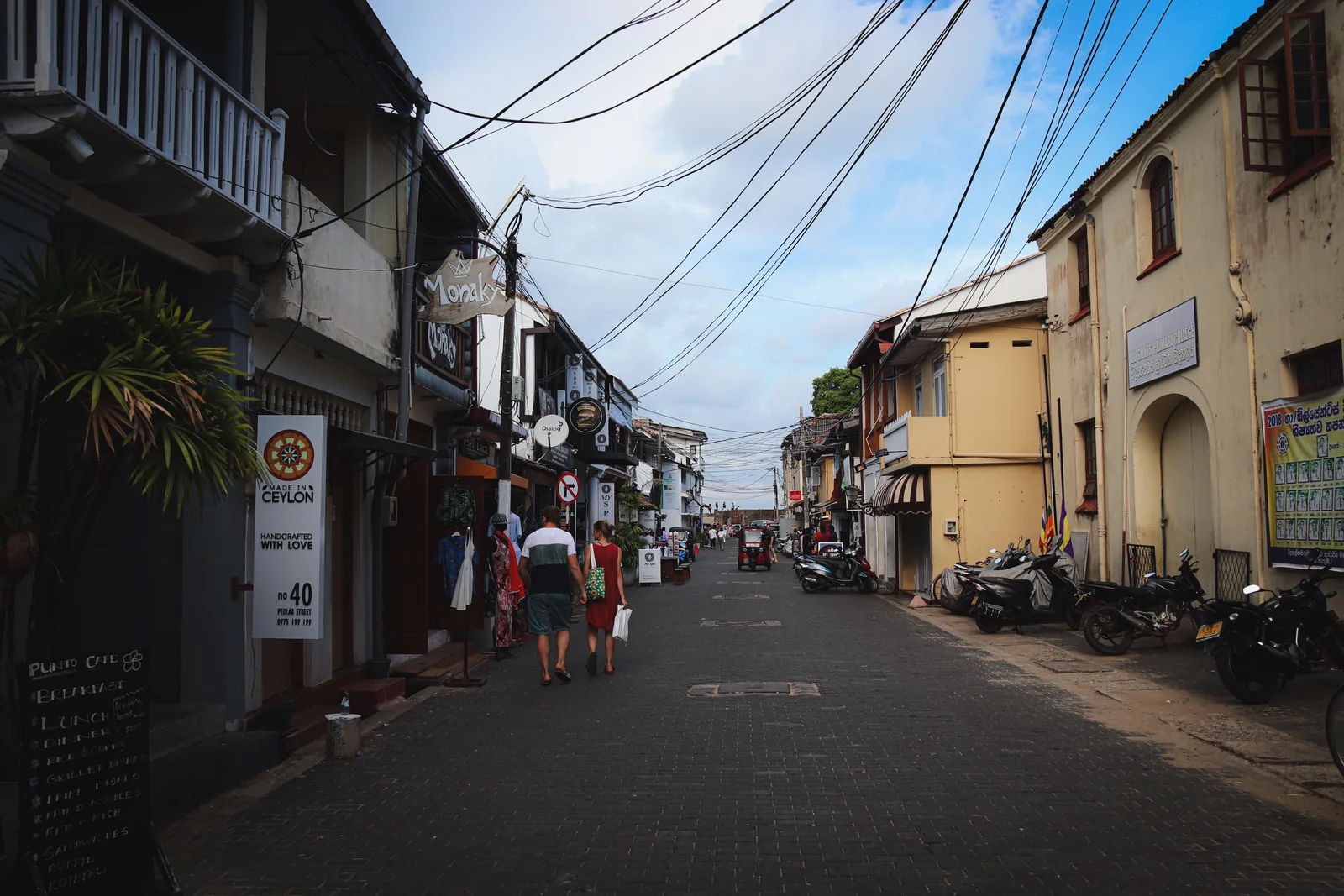 A nearly empty cobbled street inside Galle Fort in the late afternoon