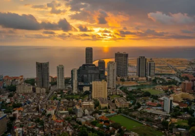 Sri Lanka weather by month: an aerial view of the Colombo skyline at golden hour with the Indian Ocean behind the towers