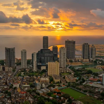 Sri Lanka weather by month: an aerial view of the Colombo skyline at golden hour with the Indian Ocean behind the towers
