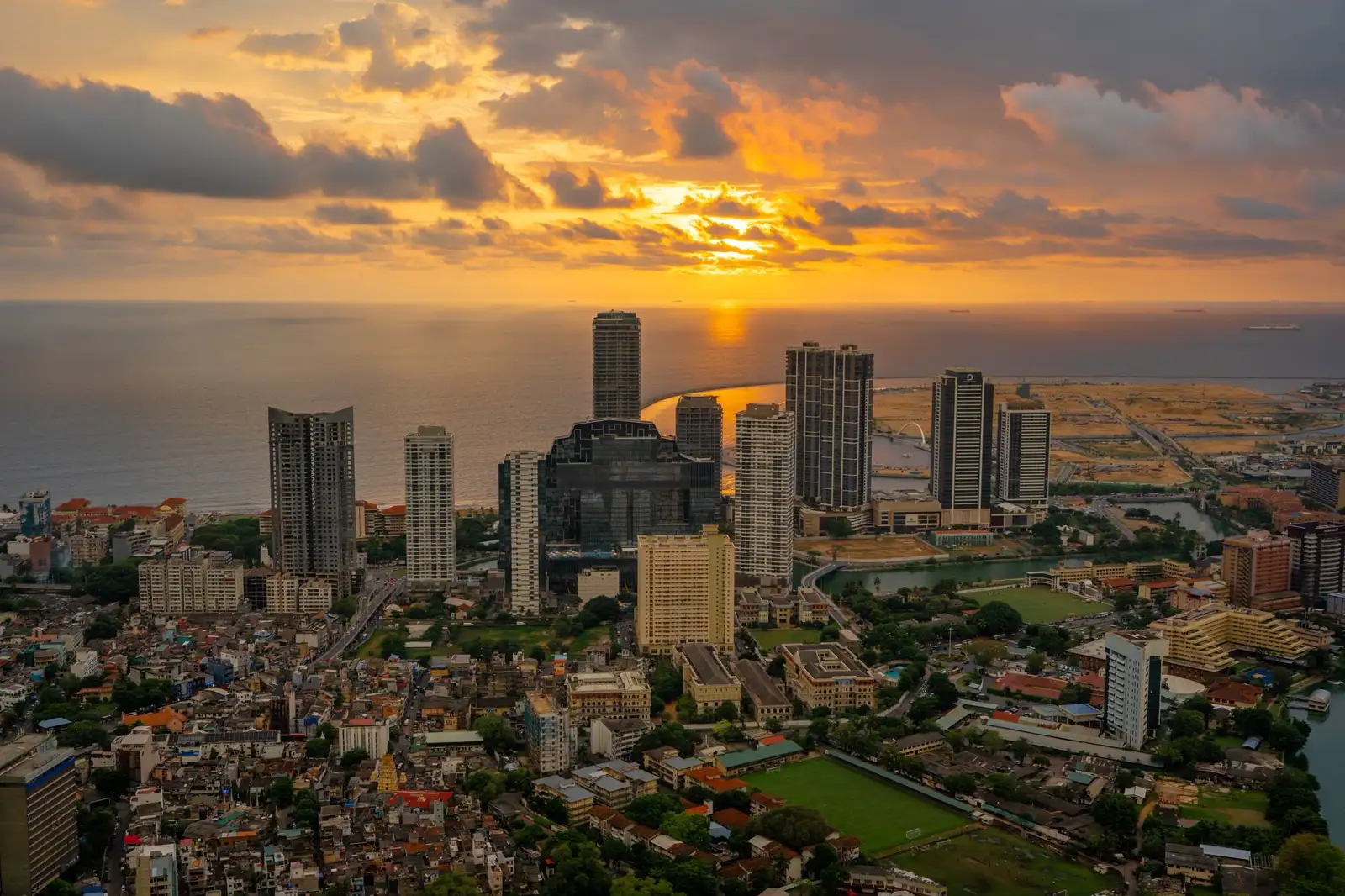 Sri Lanka weather by month: an aerial view of the Colombo skyline at golden hour with the Indian Ocean behind the towers